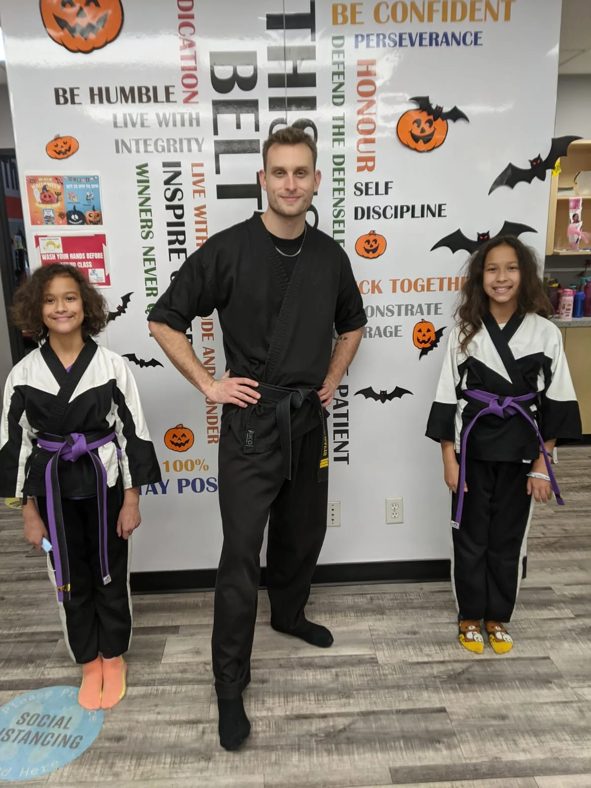 Coach working with young students in a kids martial arts class in Richmond BC